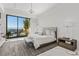 Bright bedroom featuring large windows with city views, and modern decor with a gray and white color scheme at 371 Tranquil Peak Ct, Henderson, NV 89012