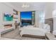 Bedroom featuring a fireplace, desk, a seating area and a balcony with city views at 371 Tranquil Peak Ct, Henderson, NV 89012