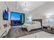 Bedroom with a stunning city view, fireplace, contemporary furniture, and a chandelier at 371 Tranquil Peak Ct, Henderson, NV 89012