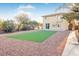 Large backyard with artificial turf and gravel at 3748 Honey Crest Dr, Las Vegas, NV 89135