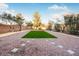 Landscaped backyard with artificial turf and gravel at 3748 Honey Crest Dr, Las Vegas, NV 89135