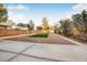 Landscaped backyard with artificial turf and gravel at 3748 Honey Crest Dr, Las Vegas, NV 89135