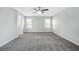 Spacious bedroom with grey carpet, ceiling fan and ensuite bathroom access at 3748 Honey Crest Dr, Las Vegas, NV 89135