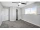 Bedroom with ceiling fan, closet, and window shutters at 3748 Honey Crest Dr, Las Vegas, NV 89135