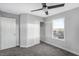 Bright bedroom with ceiling fan and window shutters at 3748 Honey Crest Dr, Las Vegas, NV 89135