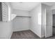 Spacious walk-in closet with built-in shelves and rods at 3748 Honey Crest Dr, Las Vegas, NV 89135