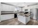 Modern kitchen with white cabinets and granite countertops at 3748 Honey Crest Dr, Las Vegas, NV 89135