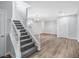 Elegant staircase with white railings and gray carpeting at 3748 Honey Crest Dr, Las Vegas, NV 89135