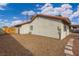 Backyard view showing gravel, a patio, and part of the house at 392 Dooley Dr, Henderson, NV 89015