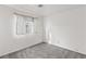 Bright bedroom with grey carpet and a window with curtains at 392 Dooley Dr, Henderson, NV 89015