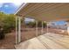 Covered patio with flagstone path and desert landscaping at 392 Dooley Dr, Henderson, NV 89015