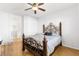 Bedroom with an ornate bed frame and ensuite bathroom at 3920 Red Trumpet Ct, North Las Vegas, NV 89081