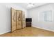 Bedroom featuring hardwood floors and decorative screen at 3920 Red Trumpet Ct, North Las Vegas, NV 89081