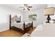 Bedroom with a wooden bed frame and ceiling fan at 3920 Red Trumpet Ct, North Las Vegas, NV 89081