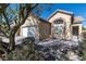 One-story house with a white garage door and landscaped front yard at 3920 Red Trumpet Ct, North Las Vegas, NV 89081