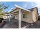 Covered patio with brick pavers and pergola at 3920 Red Trumpet Ct, North Las Vegas, NV 89081