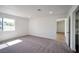 Bright bedroom with neutral carpeting and an ensuite bathroom at 3950 Ventura Way, Las Vegas, NV 89121