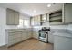 Modern kitchen featuring granite countertops and stainless steel appliances at 3950 Ventura Way, Las Vegas, NV 89121