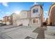 Front view of townhome community with multiple units and parking at 4039 Halfmoon Bay Dr, Las Vegas, NV 89115