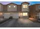 Two-story townhome with a two-car garage and driveway at 4039 Halfmoon Bay Dr, Las Vegas, NV 89115