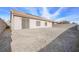 Spacious backyard with gravel and concrete patio at 4313 Beach Cliff Ave, North Las Vegas, NV 89031