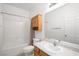 Clean bathroom with shower/tub combo, vanity, and linen cabinet at 4313 Beach Cliff Ave, North Las Vegas, NV 89031