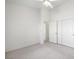 Well-lit bedroom featuring double doors and ceiling fan at 4313 Beach Cliff Ave, North Las Vegas, NV 89031