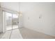 Bright dining room with sliding glass door and chandelier at 4313 Beach Cliff Ave, North Las Vegas, NV 89031