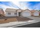 Single-story house with a two-car garage and desert landscaping at 4313 Beach Cliff Ave, North Las Vegas, NV 89031