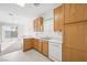 Kitchen with light wood cabinets and a view to dining area at 4313 Beach Cliff Ave, North Las Vegas, NV 89031