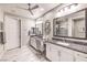 Double vanity bathroom with granite counters at 4417 S Grand Cypress Way, Pahrump, NV 89061