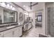 Double vanity bathroom with large mirrors at 4417 S Grand Cypress Way, Pahrump, NV 89061