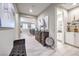 Open entryway, view of living room and powder room, with wood console table at 4417 S Grand Cypress Way, Pahrump, NV 89061