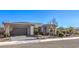 Modern single-story home with gray and white exterior, landscaping, and driveway at 4417 S Grand Cypress Way, Pahrump, NV 89061