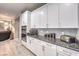 Modern kitchen with granite countertops and white cabinets at 4417 S Grand Cypress Way, Pahrump, NV 89061