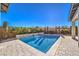 Inviting rectangular pool with stone water feature at 4417 S Grand Cypress Way, Pahrump, NV 89061