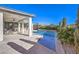 Relaxing pool area with covered patio and comfortable seating at 4417 S Grand Cypress Way, Pahrump, NV 89061