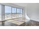 Bedroom with hardwood floors and large windows offering city views at 4575 Dean Martin Dr # 1108, Las Vegas, NV 89103