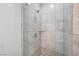 Clean shower with marble tile surround at 4575 Dean Martin Dr # 1108, Las Vegas, NV 89103