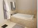 Bathroom with large soaking tub and tiled walls at 4575 Dean Martin Dr # 2001, Las Vegas, NV 89103