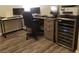 Home office with wood-look flooring, desk, and wine cooler at 4575 Dean Martin Dr # 2001, Las Vegas, NV 89103