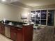 Modern kitchen with dark wood cabinets, stainless steel appliances, and a breakfast bar at 4575 Dean Martin Dr # 2001, Las Vegas, NV 89103