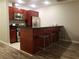 Open concept kitchen with dark wood cabinets and breakfast bar at 4575 Dean Martin Dr # 2001, Las Vegas, NV 89103