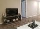 Living room with hardwood floors, flat screen TV and access to balcony at 4575 Dean Martin Dr # 2001, Las Vegas, NV 89103