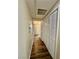 Hallway with wood-look floors and built-in storage at 5650 E Sahara Ave # 2029, Las Vegas, NV 89142