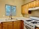 Small kitchen with light wood cabinets, white appliances, and a gas stove at 5650 E Sahara Ave # 2029, Las Vegas, NV 89142