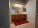 Bathroom with double vanity and red rug at 5728 Palma Del Sol Way, Las Vegas, NV 89130