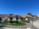 Single-story home with landscaped yard and two-car garage at 5728 Palma Del Sol Way, Las Vegas, NV 89130