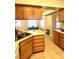 Kitchen with island and wooden cabinets at 5728 Palma Del Sol Way, Las Vegas, NV 89130