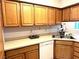 Kitchen with light countertops and wooden cabinets at 5728 Palma Del Sol Way, Las Vegas, NV 89130